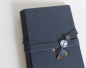 Preview: Stammbuch "Schlüssel mit Anker" aus dunkelblauem Nappaleder